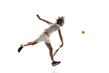 Image showing Young caucasian professional sportsman playing tennis isolated on white background