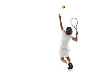 Image showing Young caucasian professional sportsman playing tennis isolated on white background