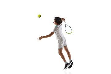 Image showing Young caucasian professional sportsman playing tennis isolated on white background