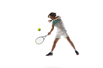 Image showing Young caucasian professional sportsman playing tennis isolated on white background