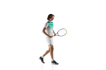 Image showing Young caucasian professional sportsman playing tennis isolated on white background