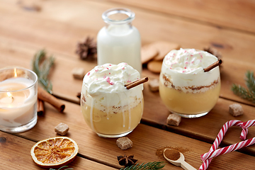 Image showing glasses of eggnog with whipped cream and spices