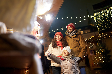 Image showing happy family at christmas market in city