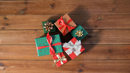 Image showing christmas gifts on wooden boards