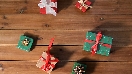 Image showing christmas gifts on wooden boards