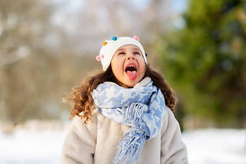 Image showing happy little girl having fun at winter park