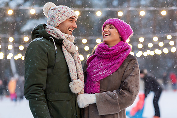 Image showing happy couple at outdoor skating rink in winter