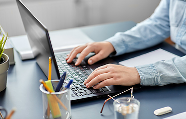 Image showing businesswoman with laptop working at office