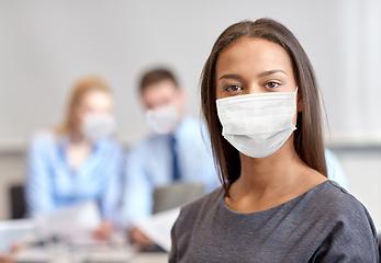 Image showing african american businesswoman in mask at office