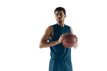 Image showing Young arabian basketball player of team posing isolated on white background. Concept of sport, movement, energy and dynamic.