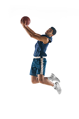 Image showing Young arabian basketball player of team in action, motion isolated on white background. Concept of sport, movement, energy and dynamic.