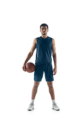 Image showing Young arabian basketball player of team posing isolated on white background. Concept of sport, movement, energy and dynamic.