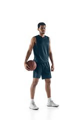 Image showing Young arabian basketball player of team posing isolated on white background. Concept of sport, movement, energy and dynamic.