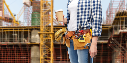 Image showing woman with takeaway coffee cup and working tools