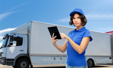 Image showing delivery girl with tablet computer over truck