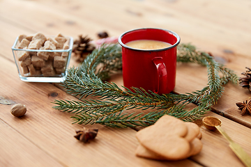 Image showing cup of eggnog, fir branches, gingerbread and sugar