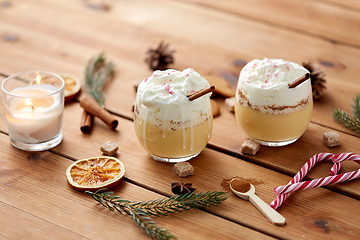 Image showing glasses of eggnog with whipped cream and spices