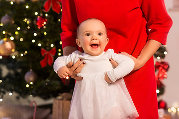 Image showing mother with happy baby daughter at christmas tree