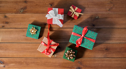 Image showing christmas gifts on wooden boards