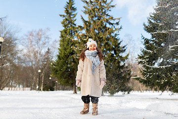 Image showing happy little girl in winter clothes outdoors