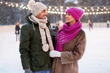 Image showing happy couple at outdoor skating rink in winter