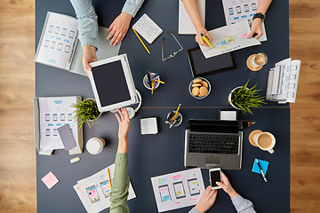 Image showing business team with gadgets working at office table