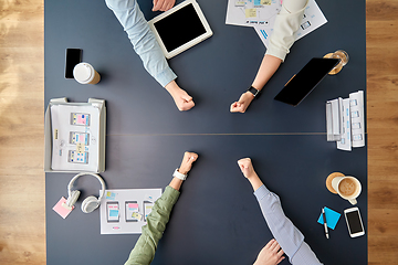 Image showing business team showing thumbs up at office table