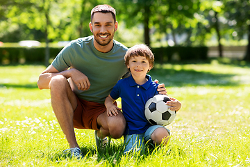 Image showing father and little son with soccer ball at park