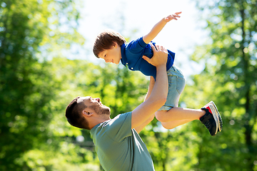 Image showing happy father with son playing in summer park