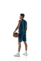 Image showing Young arabian basketball player of team posing isolated on white background. Concept of sport, movement, energy and dynamic.