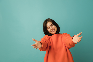 Image showing Caucasian woman\'s portrait isolated on blue studio background with copyspace