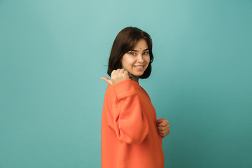 Image showing Caucasian woman\'s portrait isolated on blue studio background with copyspace