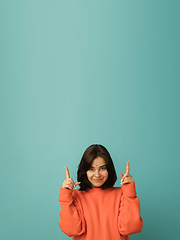 Image showing Caucasian woman\'s portrait isolated on blue studio background with copyspace