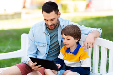 Image showing father and son with tablet pc computer at park