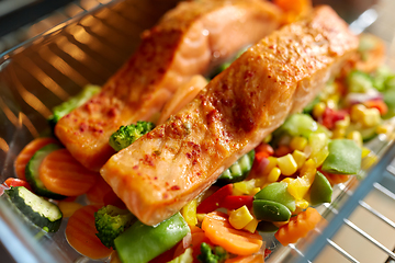 Image showing food cooking in baking dish in oven at home