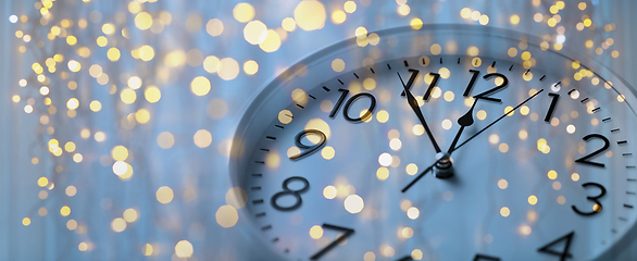 Image showing wall clock with christmas lights