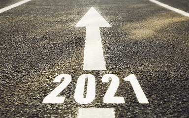 Image showing white road marking in shape of 2021 year and arrow