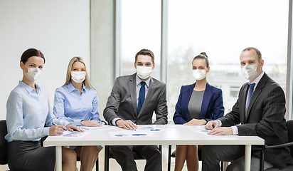 Image showing business people in masks meeting at office