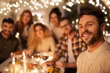 Image showing friends taking selfie at christmas dinner party