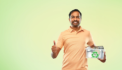 Image showing smiling young indian man sorting metallic waste