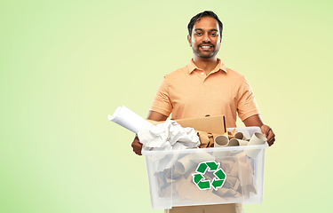 Image showing smiling young indian man sorting paper waste