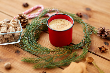 Image showing cup of eggnog, fir branches, gingerbread and sugar