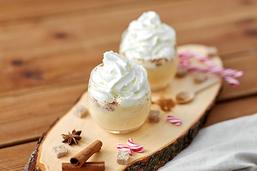 Image showing glasses of eggnog with whipped cream and anise