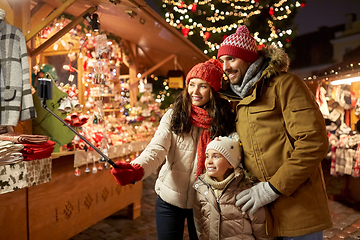 Image showing happy family taking selfie at christmas market