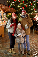 Image showing family with takeaway drinks at christmas market