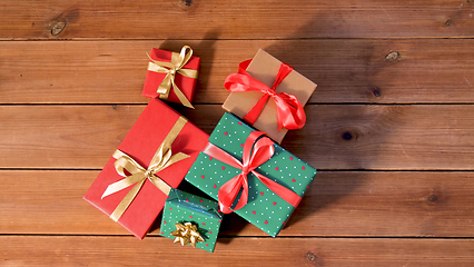 Image showing christmas gifts on wooden boards