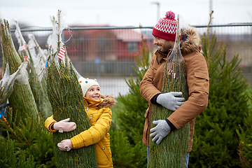 Image showing happy family buying christmas tree at market