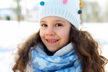 Image showing happy little girl in winter clothes outdoors