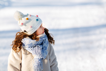 Image showing little girl in winter clothes outdoors