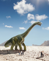 Image showing Dinosaur huge higth walking through the sunny desert comes across little shocked group of people